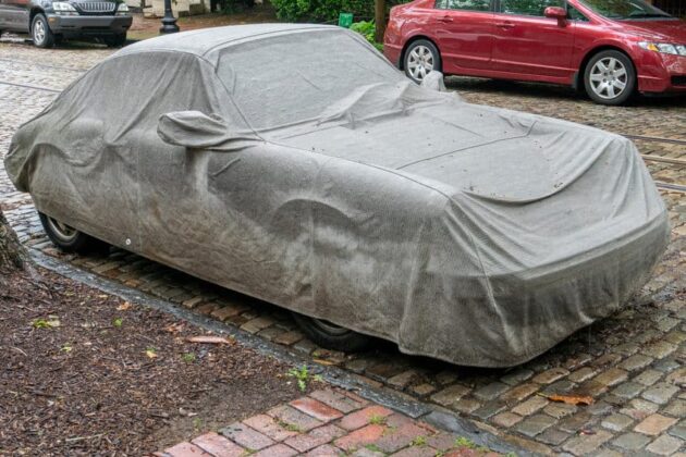 A Porsche 911 parked on the side of the street with a protective car cover 630x420 The Advantages of Investing in a High Quality Car Cover