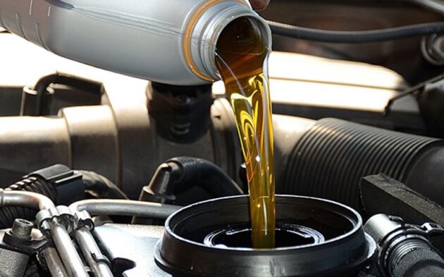 GuideOnChangingOil AddThe New OilAndOilFilter 630x394 Tips for Changing Your Oil for the First Time