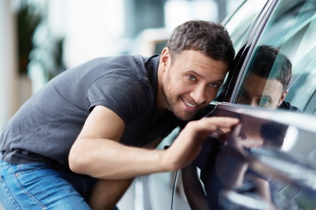 Man Inspecting Side of Car 630x419 How to Shop for a Used Car: Tips and Tricks